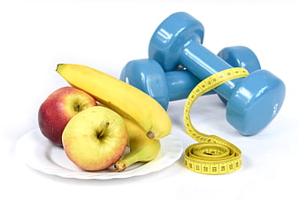 Healthy Diet and Fitness Concept with Fruit and Dumbbells