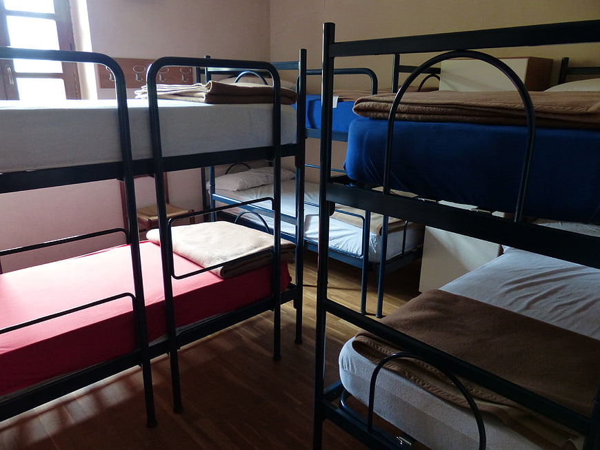 Bunk beds in a youth hostel dormitory room