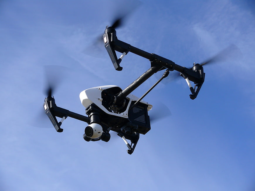 DJI Inspire Drone Flying Against Blue Sky