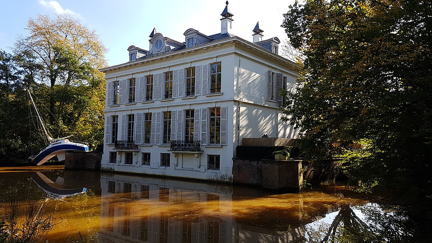 Historic White Mansion on River in Autumn Belgium