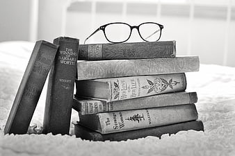 Vintage Books and Glasses on Bed