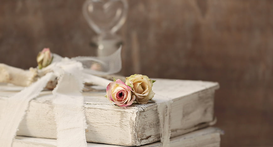 Vintage white books with pink roses and antler