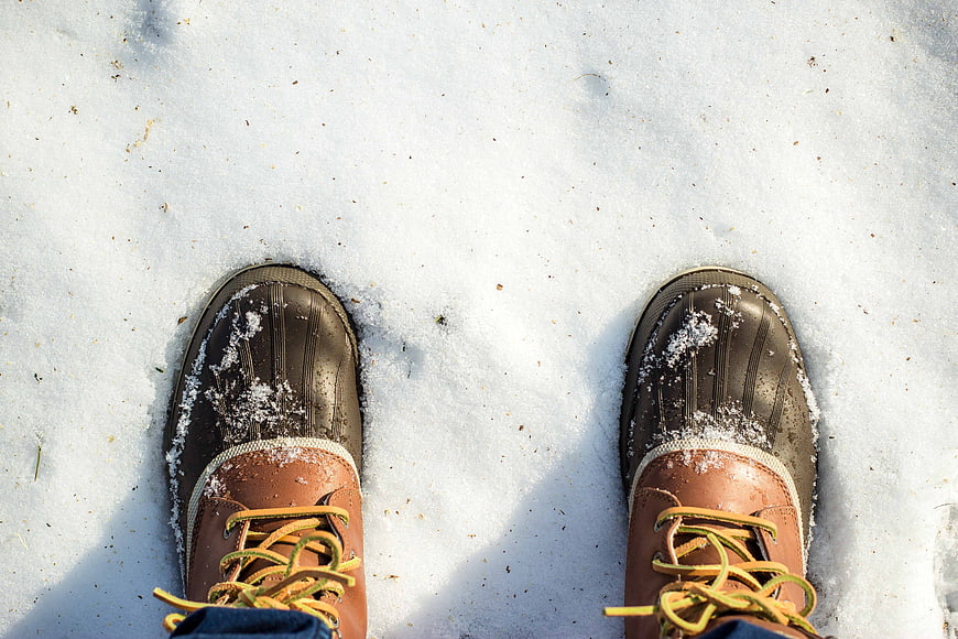 Brown Winter Boots Standing In Fresh Snow