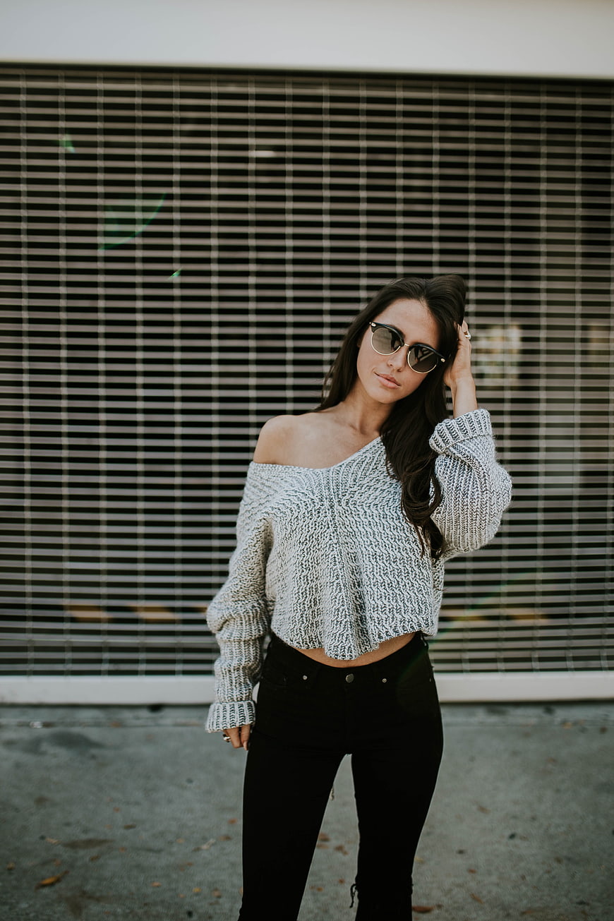 Stylish Woman in Off-Shoulder Sweater and Sunglasses