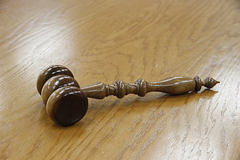 Wooden Gavel on Light Wood Table Surface
