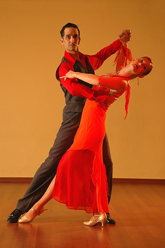 Passionate Latin Dance Couple in Red and Black Studio