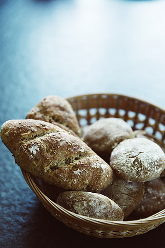 Rustic Artisan Bread Loaves in Wicker Basket