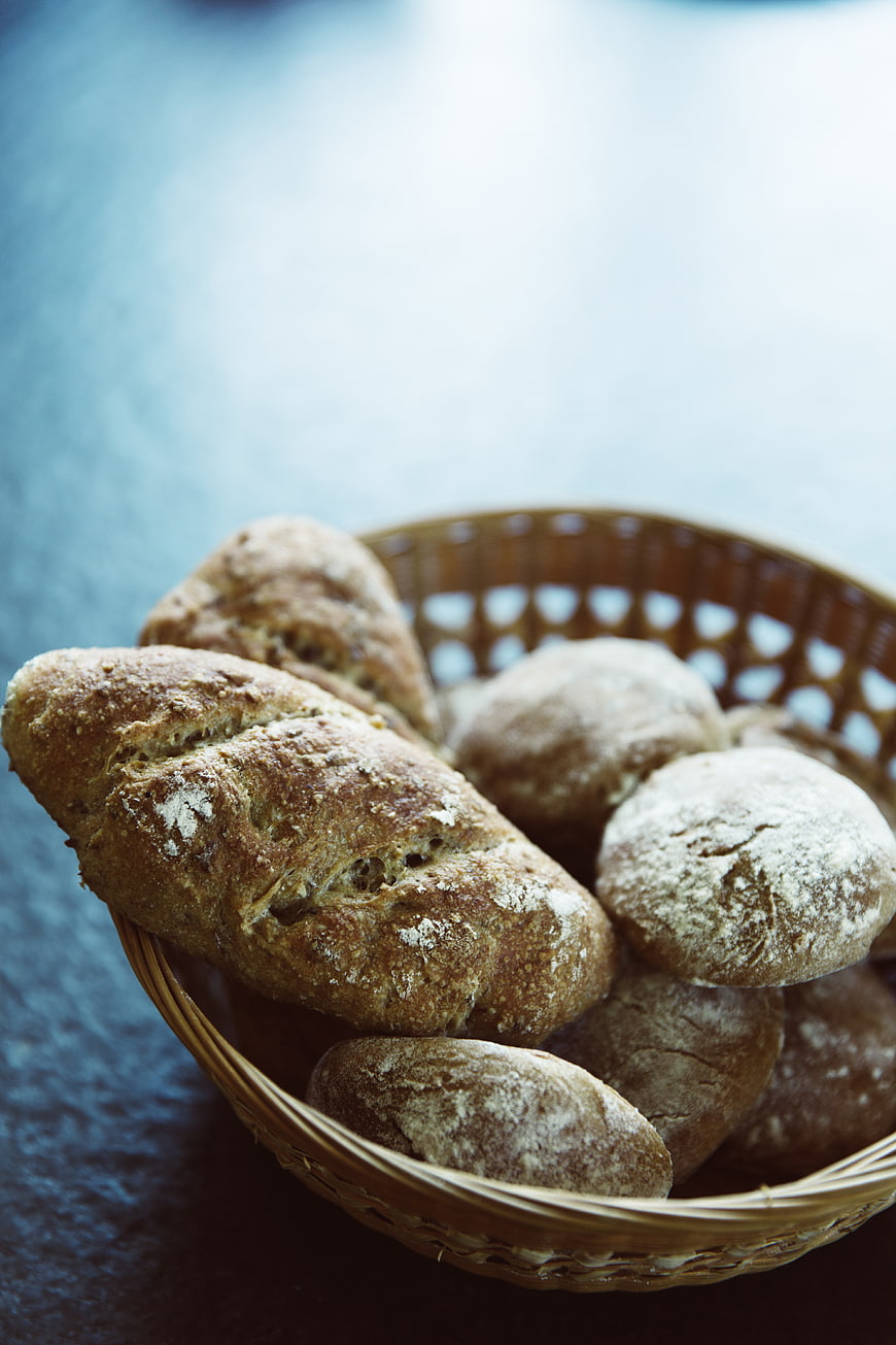 Rustic Artisan Bread Loaves in Wicker Basket