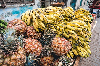 Fresh pineapples and ripe bananas at a Cuban street market