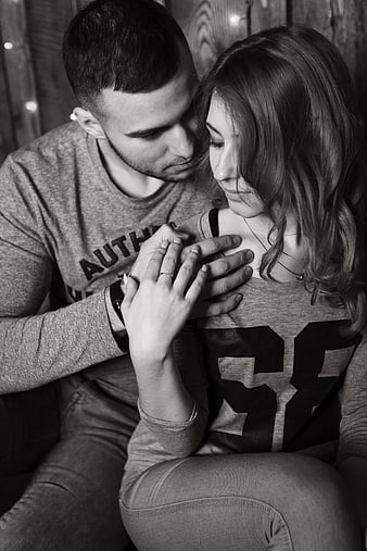 Intimate Black and White Portrait of Couple Holding Hands