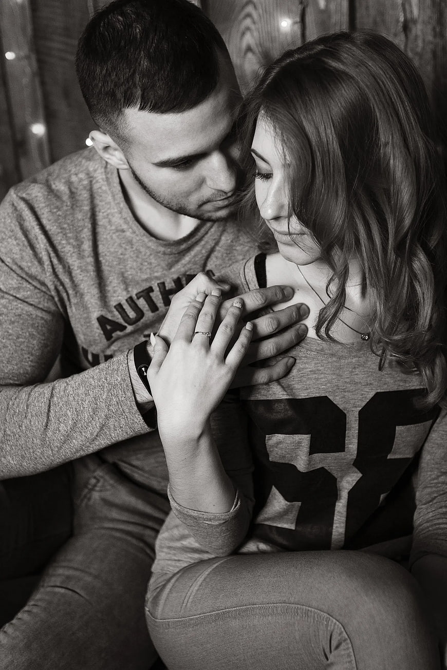 Intimate Black and White Portrait of Couple Holding Hands