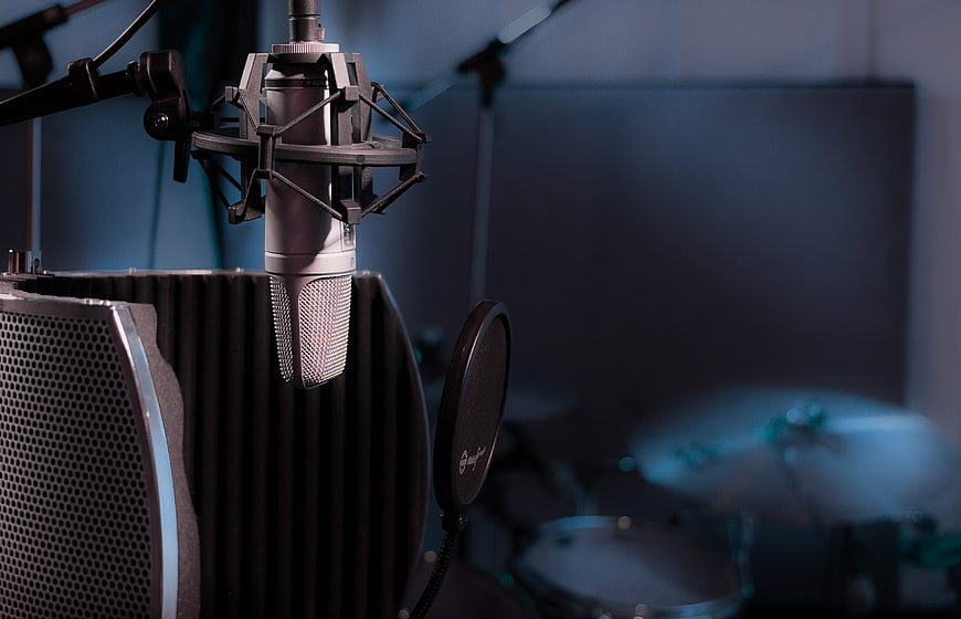 Professional Studio Microphone Setup With Pop Filter And Drum Kit