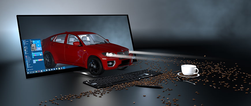 Red SUV 3D Model on Computer Monitor with Coffee Beans