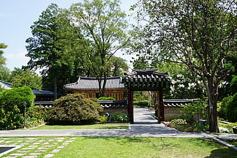 Traditional Korean Hanok Gate in Lush Garden