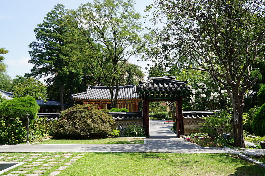 Traditional Korean Hanok Gate in Lush Garden