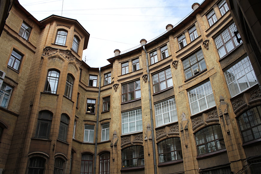 Low angle view of historic yellow brick architecture in Saint Petersburg