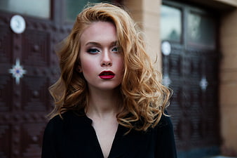 Portrait of Young Woman with Red Lips and Wavy Hair