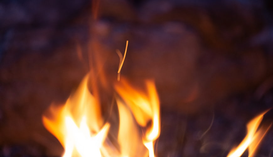 Close-up of flickering campfire flames at night