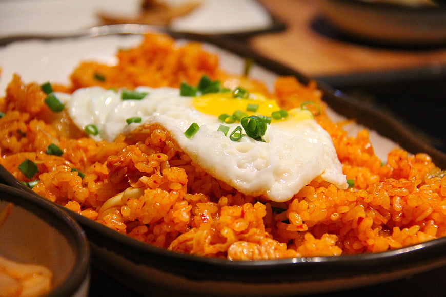 Close-up of spicy kimchi fried rice with fried egg