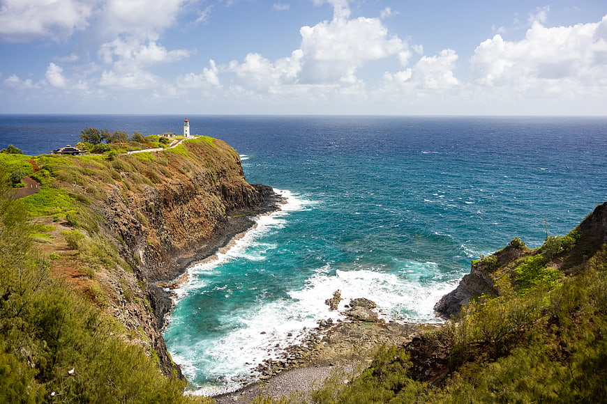 Scenic Lighthouse on Rugged Coastal Cliff Overlooking Ocean