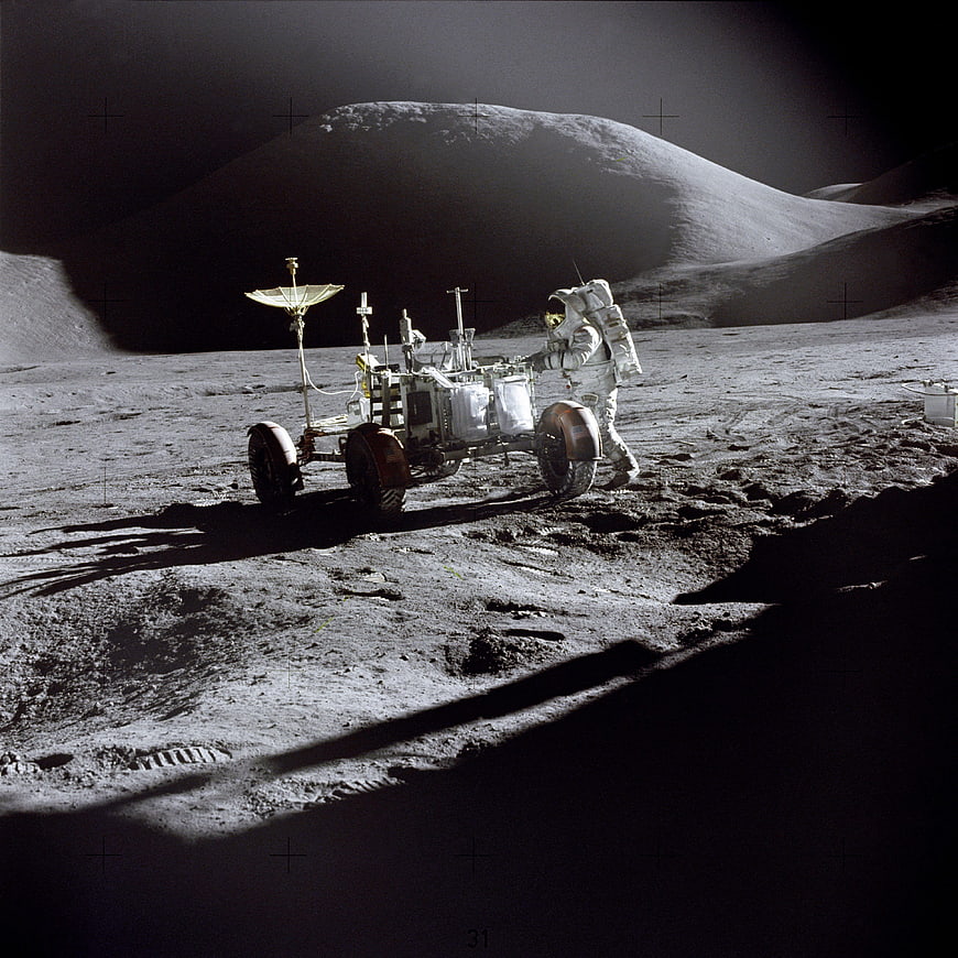 Astronaut Operating Lunar Roving Vehicle on Moon Surface