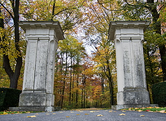 Autumn Park Entrance with Classical Stone Pillars
