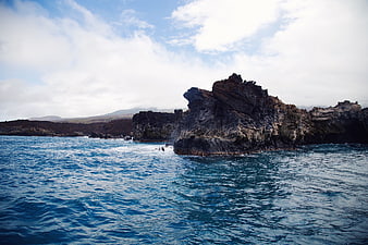 Dramatic coastal cliffs meeting deep blue ocean waters