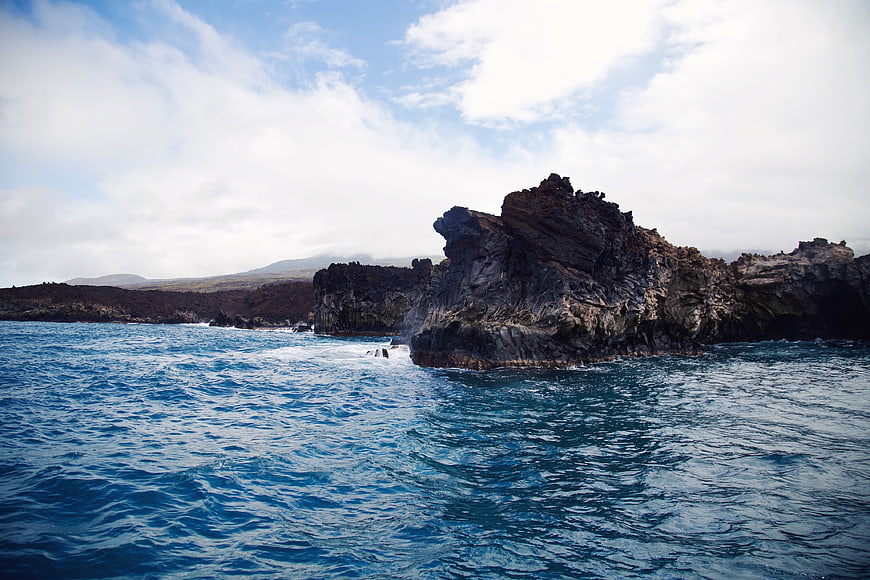 Dramatic coastal cliffs meeting deep blue ocean waters
