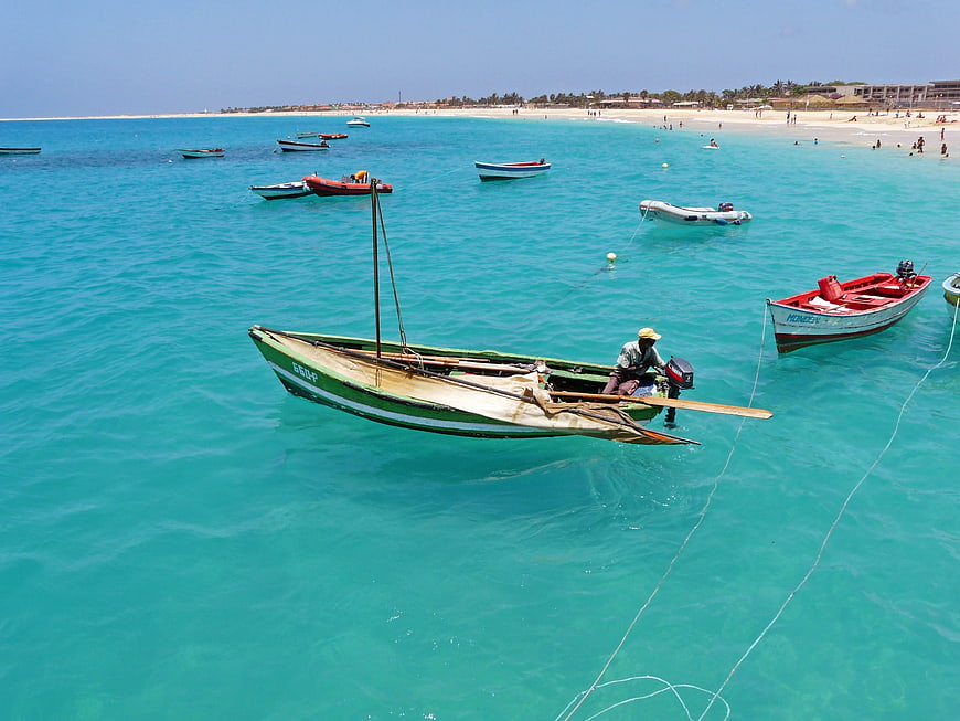 Fisherman in traditional boat on turquoise Cape Verde waters
