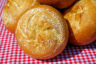 Freshly Baked Bread Rolls on Red Checkered Tablecloth