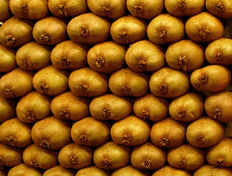 Close-up texture of stacked fresh kiwi fruits
