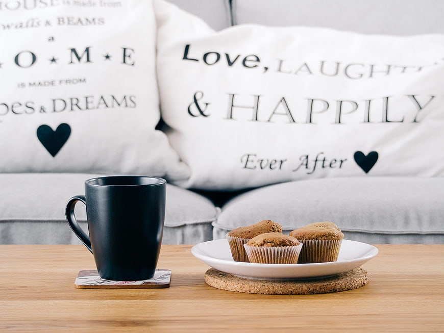 Cozy Home Breakfast Scene With Muffins And Coffee On Wooden Table