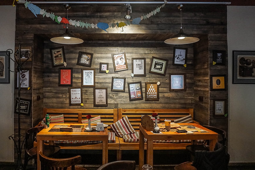 Cozy rustic cafe interior with wooden furniture and coffee art