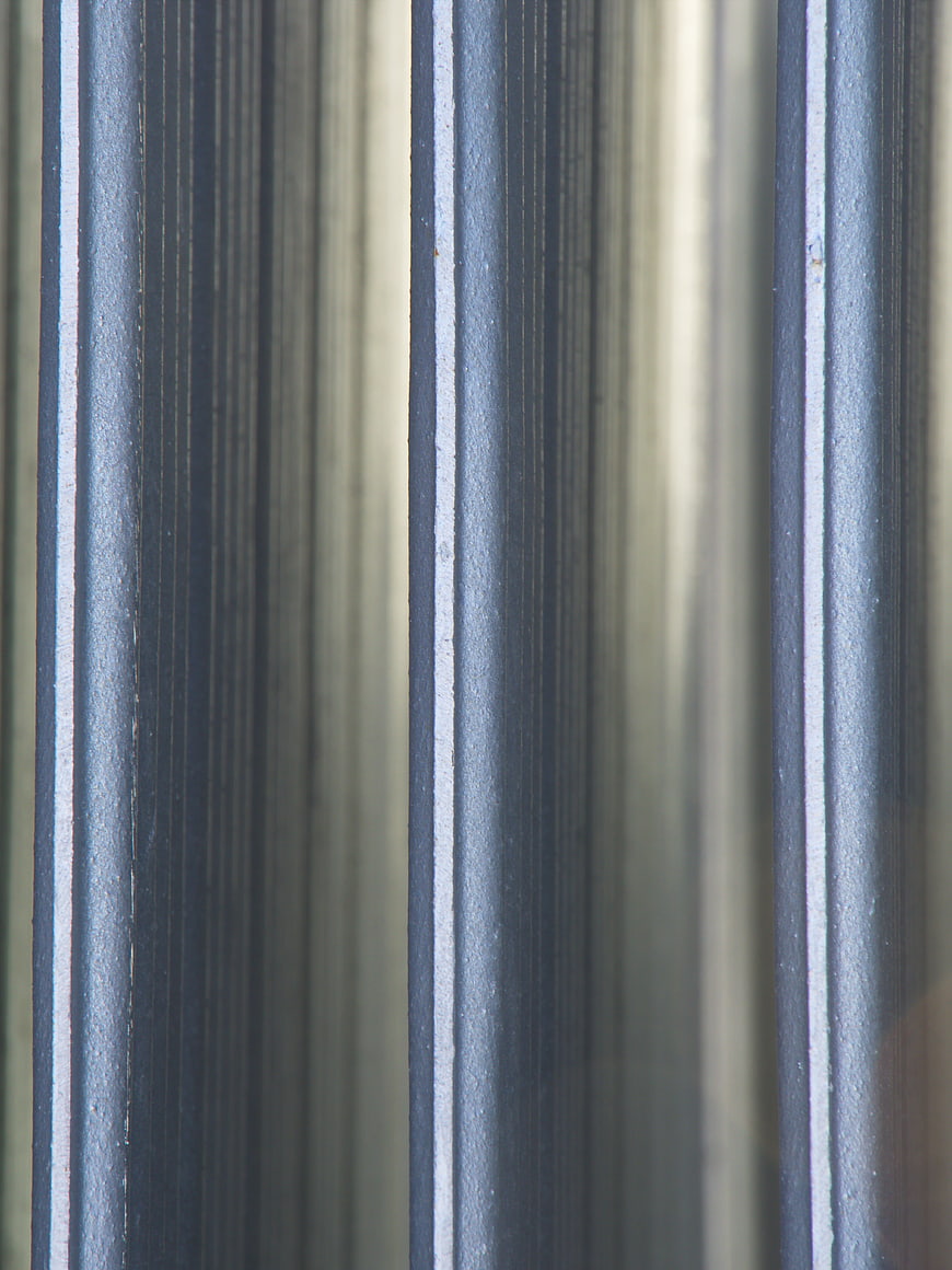 Close-up of brushed metal texture with vertical lines
