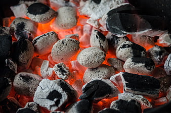 Glowing charcoal embers for barbecue grill