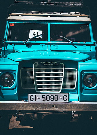 Front view of vintage turquoise Land Rover Santana