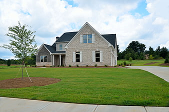 Modern Brick Suburban Home With Landscaped Front Yard