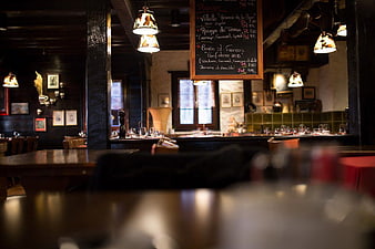 Cozy French Bistro Interior with Hanging Chalkboard Wine Menu