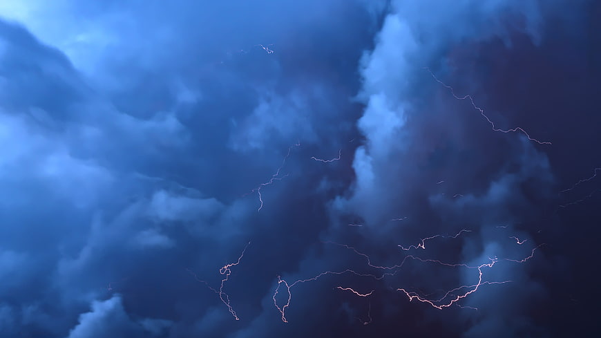 Dramatic Lightning Storm in Dark Blue Cloudy Sky