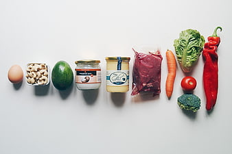 Flat lay of healthy fats ingredients on white background