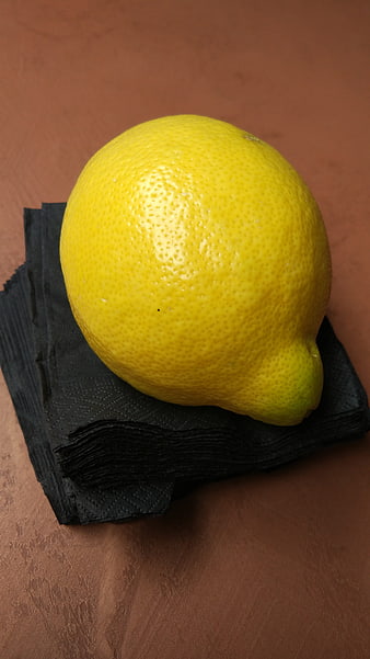 Fresh Yellow Lemon on Black Napkin