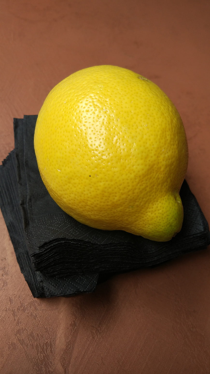 Fresh Yellow Lemon on Black Napkin