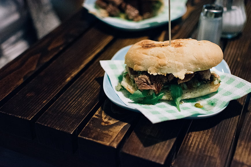 Argentinian beef steak sandwich on wooden table
