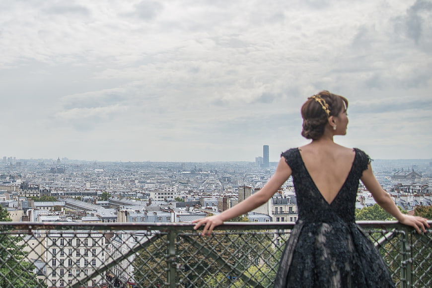 Bride in Black Dress Overlooking Paris Cityscape