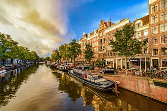 Amsterdam Canal with Traditional Dutch Houses and Boats