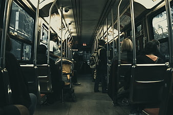 Interior of a public bus with commuters and passengers