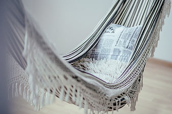 Cozy Indoor Hammock With Newspaper And Fringe Detail