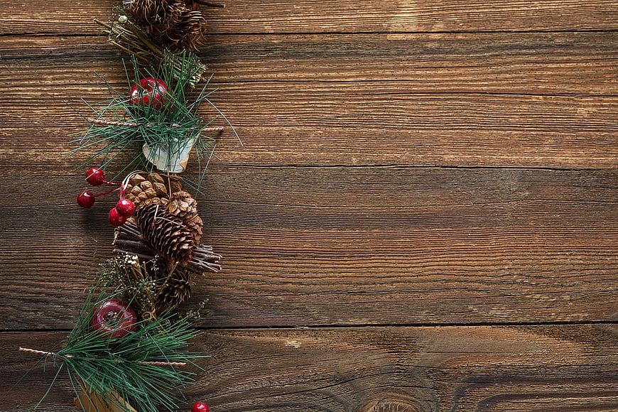 Christmas decorations on rustic wooden background with copy space