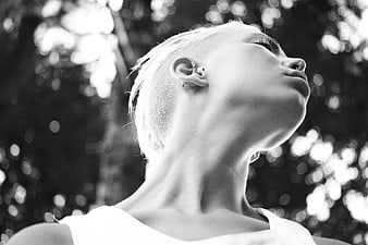 Black and white portrait of woman with short hair looking up