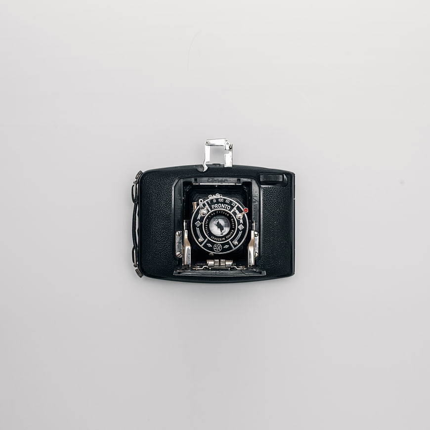 Vintage Black Film Camera on White Background